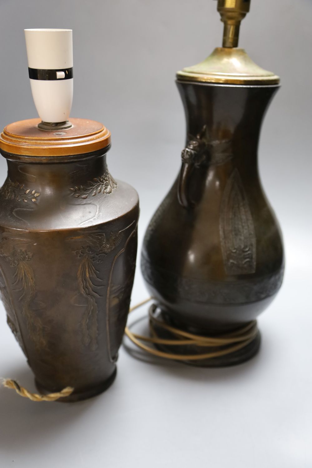 A Japanese bronze vase, late 19th century, later mounted as a lamp and a similar bronzed finished lamp